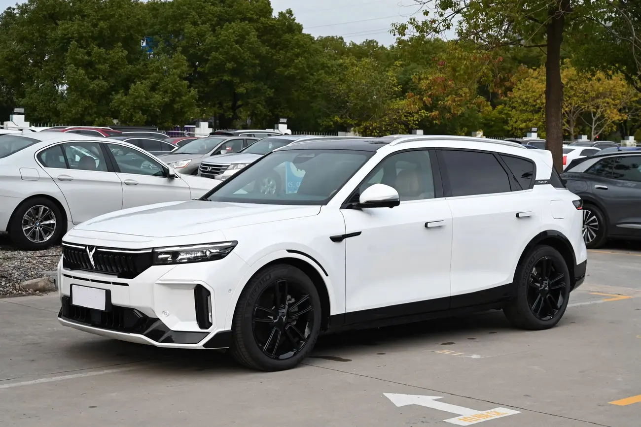 Dongfeng electric car on the road, front three-quarter view