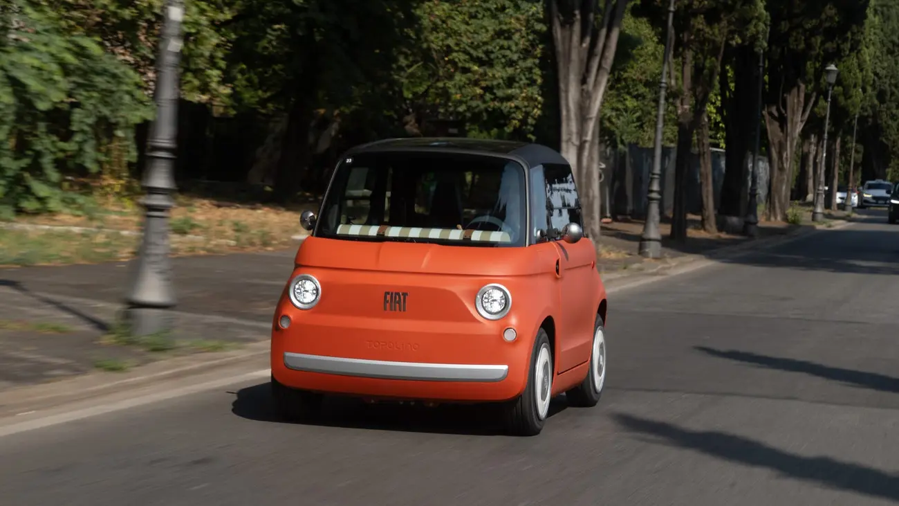 Two-seat Fiat Topolino electric quadricycle parked on a city street