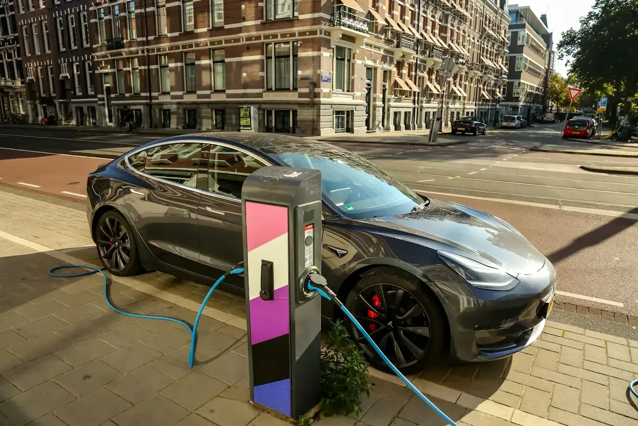 Electric car plugged into a public charging point