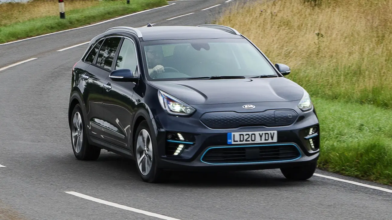 First-generation Kia e-Niro driving on a country road