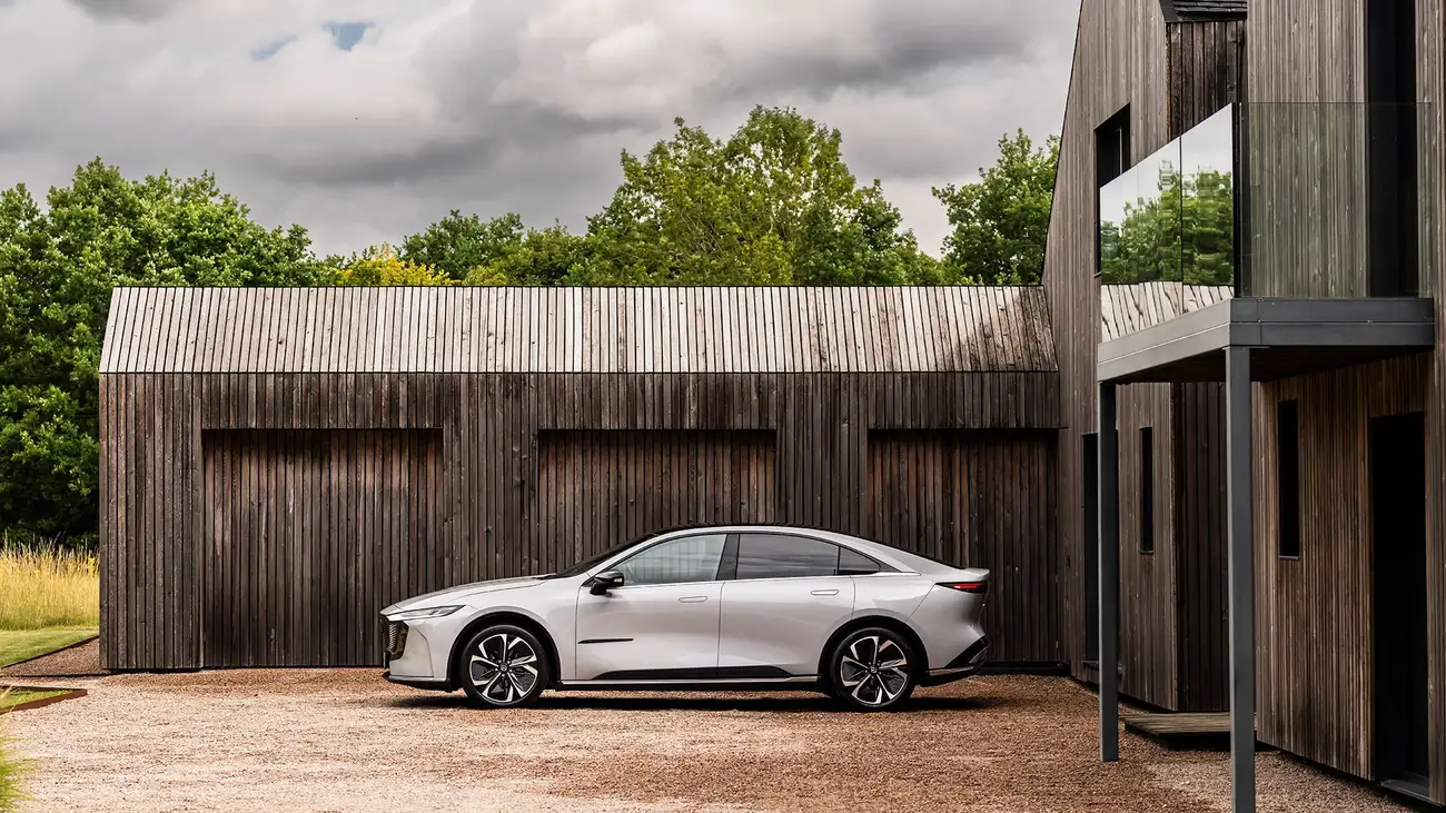 Mazda 6e electric saloon seen in profile on a road