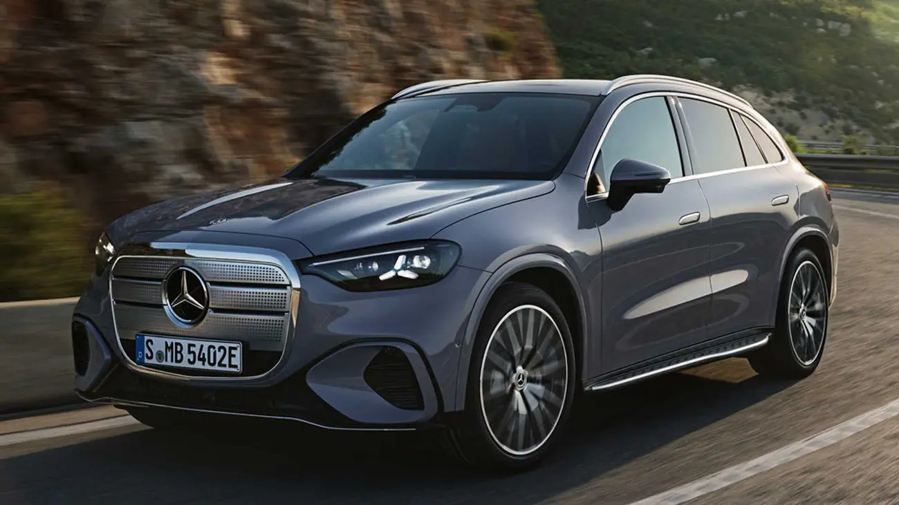Mercedes GLC electric in motion, side profile on a road