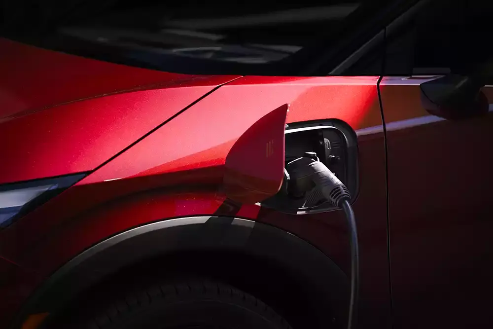 New Nissan Leaf charging at a DC fast-charging station
