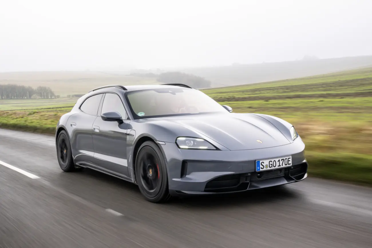 Porsche Taycan Sport Turismo side profile on a road