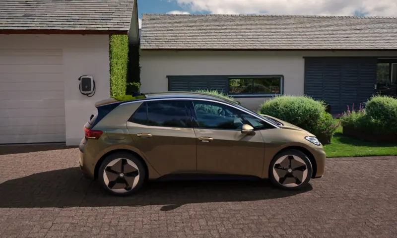 Volkswagen ID.3 electric car plugged into a home wallbox charger in a driveway