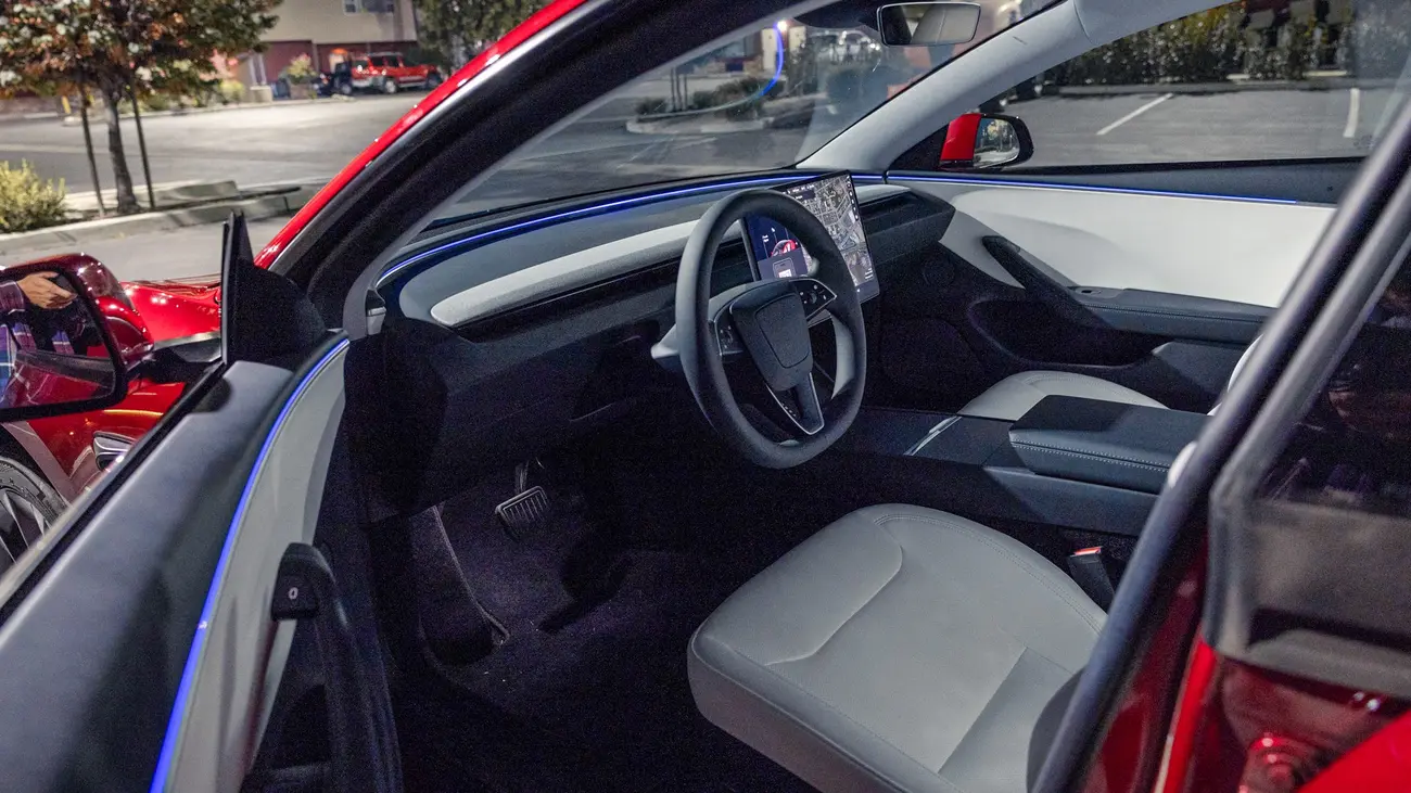 Tesla Model 3 Highland interior with central touchscreen and minimalist dashboard