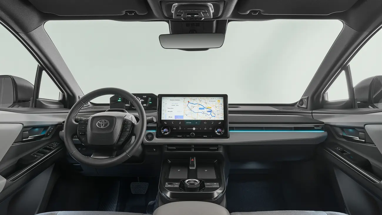 Toyota C-HR+ cabin showing the 14-inch central display and digital instrument cluster