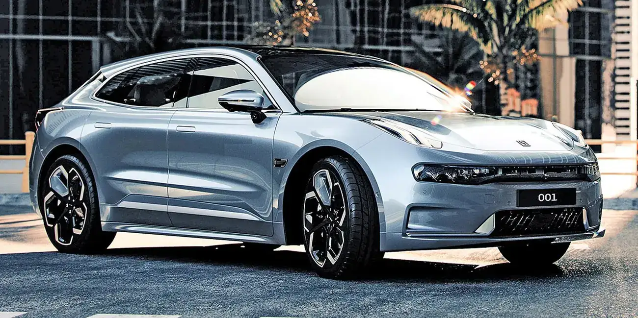 Zeekr 001 seen from the front three-quarter angle outdoors, showing its shooting-brake silhouette